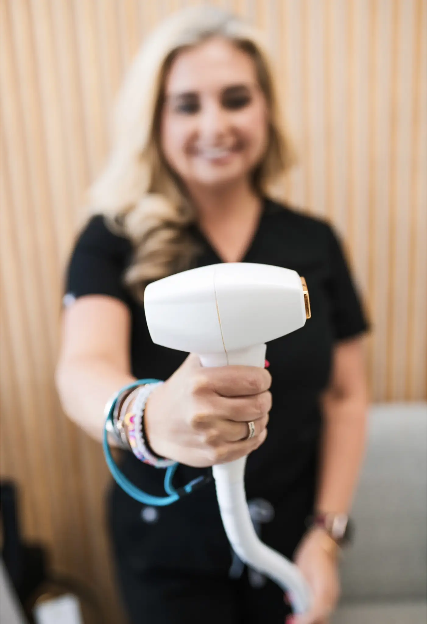 Woman showing aesthetic treatment tool | Culture Aesthetics and Wellness | Knoxville, TN